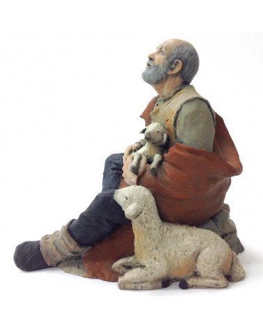 Shepherd sitting and sheet
