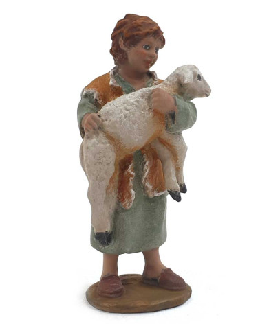 Bambino con un agnello